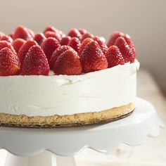 a white cake with strawberries on top