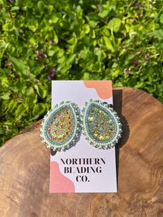 Handcrafted Indigenous beaded earrings. The Cape Breton earrings are part of our new collection inspired by Canada. They feature gentle blue and gold tones, and are small enough for everyday wear but large enough to make a statement. Made with stainless steel stud fastenings to reduce irritation and improve comfort. Each item is carefully handcrafted in Northern Ontario, making every pair unique. Let me know if you have any questions! Beaded Earring Studs, Cape Breton, Beaded Earrings Patterns, Large Earrings, Earring Patterns, Teardrop Earrings, Alex And Ani Charm Bracelet, Jewelry Earrings Studs, Gifts For Family