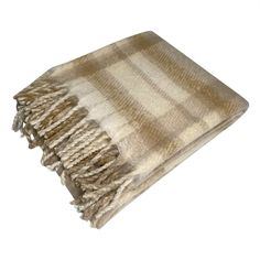 a tan and white striped blanket with fringes on the bottom, in front of a white background