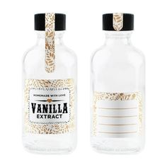 two bottles with labels on them sitting next to each other in front of a white background