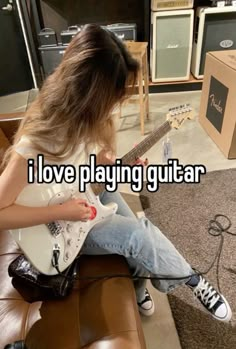 a person sitting on top of a couch with a guitar in front of them and the words i love playing guitar