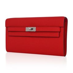 Guaranteed authentic Hermes Kelly Classique To Go Verso wallet featured in Rouge de Coeur with Rose Extreme interior.This beautiful Hermes red is accentuated in Epsom leather. Often carried as a clutch, this Kelly wallet beauty is a jewel in your hand.Kelly Cadena zipper pull. Twelve (12) credit slots. Two (2) bill pockets. Zip change purse. Palladium hardware. NEW or NEVER WORN.final saleWALLET MEASURES:LENGTH 7.8" WIDTH 4.5"DEEP .6"CONDITION:NEW or NEVER WORN Kelly Wallet, Hermes Wallet, Bible Bag, Designer School Bags, Luxury Bags Collection, Ladies Wallet, Red Clutch, Red Accessories, Change Purse