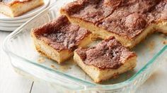 several pieces of cake sitting in a glass dish