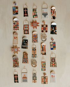 many small ornaments are hanging on the wall