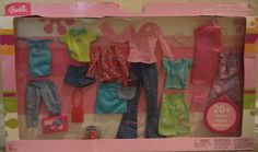 a barbie doll with clothes and accessories in its box