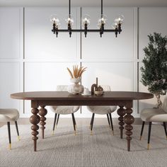 a dining room table with chairs and a potted plant on the top, in front of a white paneled wall