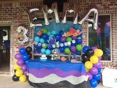 a birthday party with balloons and decorations