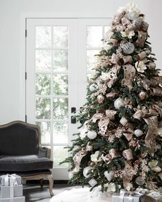 a decorated christmas tree in a living room