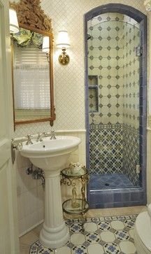 a bathroom with a shower, sink and toilet