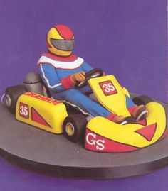 a toy car with a man driving it on the front wheel and number 35 on the side