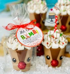 some cupcakes with white frosting and reindeer decorations