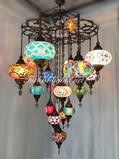 a chandelier with many colorful lights hanging from it