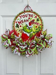 a door hanger that says you're a mean one with the grinch on it