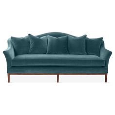 a blue couch with pillows on it