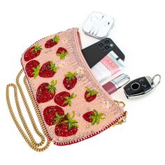 Juice up your wardrobe with Mary Frances' Strawberry Fields. This sweet crossbody handbag mixes fiery red, beaded strawberries on a sparkling pink backdrop to make a pairing that's on fire! 10.75 x 1.25 x 6" Strap Length End to End: 49" Strap Drop: 23" Removable crossbody chain strap Zipper closure Inside pocket Back pocket Fits a phone Includes: metal logo fob, protective storage bag, certificate of authenticity This is a handmade item, each one an individual work of art. Slight variations may Lovecore Fashion, Strawberry Purse, Diy Purse Making, Handbag Diy, Teapots Unique, Pink Backdrop, Mary Frances, People Clothes, Girly Bags