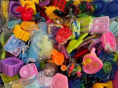 there are many different types of toys in the box together, including scissors and other items