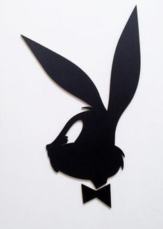 the silhouette of a rabbit with a bow tie on it's head is shown