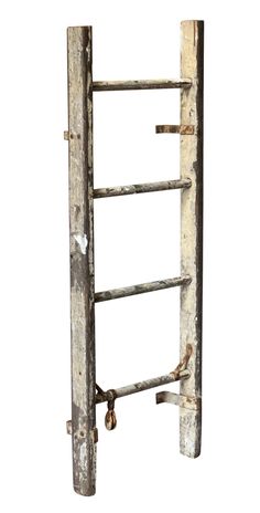 an old wooden ladder leaning against a white wall with rusted metal bars on it