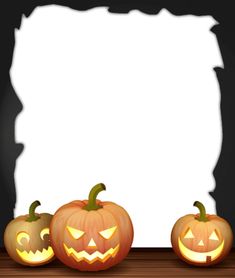 three pumpkins with faces carved into them sitting on a wooden table next to an empty sheet