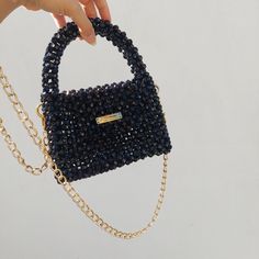 The shiny black bead bag, made with care and 100% hand labour, is a great option to accompany you on your special days. You can gift it to your loved ones. Gold chain detail gives a different aesthetic to the handmade black bead bag. It will be sent in a storage pouch and you can keep your bag in this way. Your phone, lipstick, airpods, cards and other minimal items can easily fit inside.  *Details - Completely handmade - High quality, colourfast acrylic beads - Suitable for phone, wallet, basic Bead Purse, Bead Bag, Bag Aesthetic, Elegant Bags, Bag Elegant, Beaded Purses, Black Acrylics, Beaded Bags, Bag Handmade