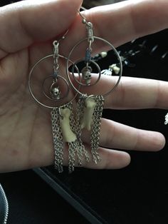 Earrings have skull bead inside hoop within a hoop, from which a coyote bone and silver chain is hanging. Approx 3 inches long Chain Earing, Cats Eye Gem, Oddities Jewelry, Goth Core, Eye Gems, Bone Earrings, Shark Tooth Necklace, Tooth Necklace, Jewelry Techniques