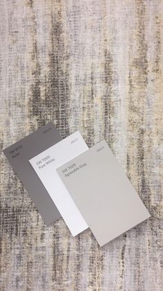 two different shades of gray and white on a carpet with some colors to choose from