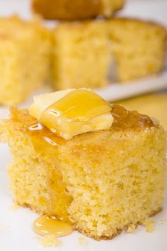 there is a piece of cake on the plate with caramel sauce and icing