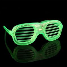 glow in the dark glasses with reflective arms and sides are glowing green, while one pair is