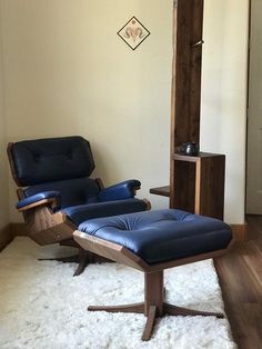 two recliners in a living room with white carpet and wooden furniture on the floor