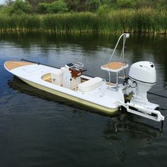 a small motor boat is parked in the water