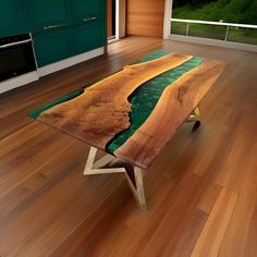 a coffee table made out of wood with green paint on the top and bottom part