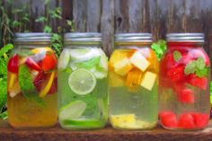 four mason jars filled with different types of fruit