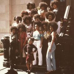 a group of women and children posing for a photo