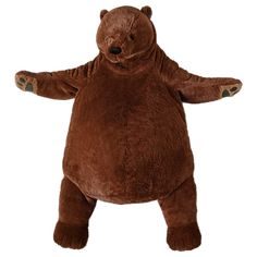 a large brown teddy bear standing on one leg and arms spread out to the side