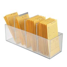 a stack of yellow folders in a clear holder