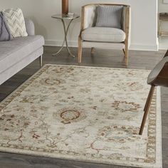 a living room filled with furniture and a rug