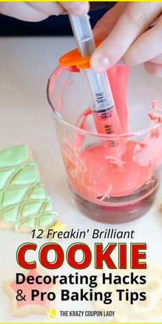 someone is decorating cookies and baking tips with pink icing in a glass bowl