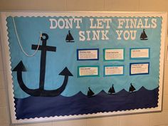 a bulletin board with an anchor and sailboats on it that says don't let finals sink you