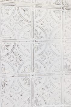 an image of a white tile pattern that looks like it has been painted