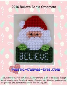 a christmas ornament with a santa clause on it's face and the words believe