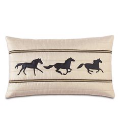 an embroidered pillow with three horses running in the same direction, on a white background