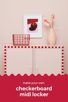 a red and white checkerboard cabinet next to a pink wall with a vase on top