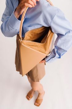 An iconic piece that will transform your everyday outfit. The Flex Hobo is designed with a modern geometric aesthetic and architectural feel. It is an incredibly roomy bag with plenty of space inside for all of your essentials, including mobile phone, tablet, big wallet and even 500 ml water bottle! Crafted from Italia Geometric Aesthetic, Suede Top, Suede Tops, Secret Sale, Everyday Outfit, New Launch, Feel It, Cow Leather, Everyday Outfits