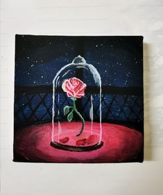 a painting of a rose under a glass dome