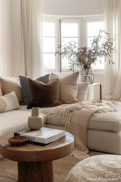 a living room filled with furniture and pillows