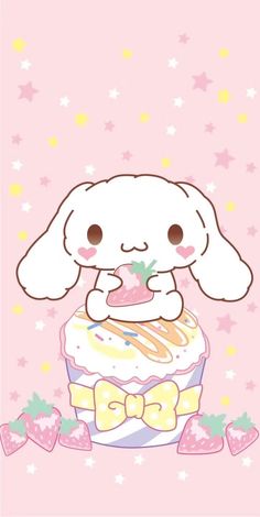 a cartoon bunny sitting on top of a cupcake