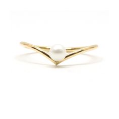 a gold ring with a white pearl in the middle and two curved bands around it