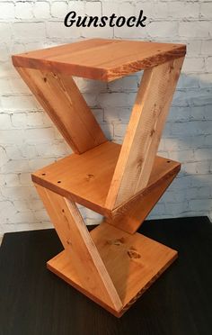 a wooden stand with the words gunstock on it and an image of a brick wall behind it