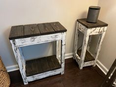 two white wooden tables sitting next to each other on top of a hard wood floor