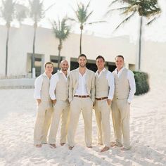 a group of men standing next to each other in the snow